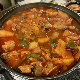 a pan of stew with meat and vegetables
