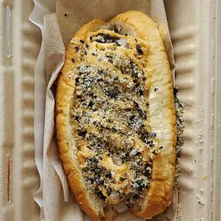a muki dog in a styrofoam container