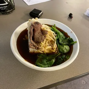 Some super dark odd tasting broth that gave me a tummy ache. Beef pho.