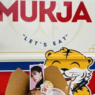 a person holding a box of food