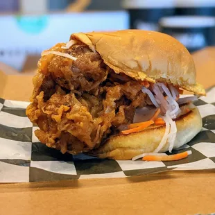 Bird on a Bun. Martin&apos;s potato bun, fried chicken thigh, pickled veggies, comeback sauce, with side (not pictured). $12.