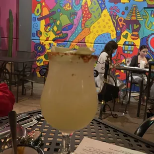 a colorful mural in the background