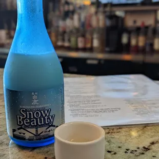 a blue bottle of snow beauty