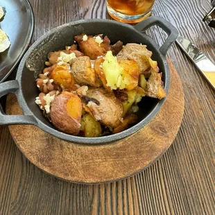 Side of potatoes and beans with the chilaquiles.
