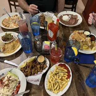 a table full of food and drinks
