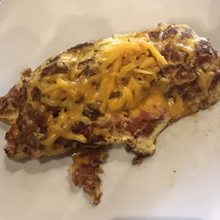 Looks like hash-browns but it's the extra well done (burnt) cheese omelet I ordered.