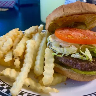 Hamburger special with fries and a drink.
