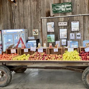 a fruit stand in a barn