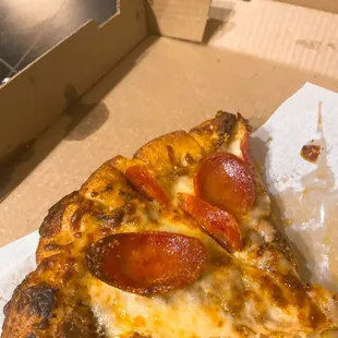a slice of pepperoni pizza