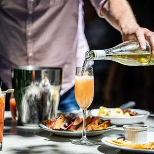 Mimosa samplers or bottomless bubbles, served at Weekend Brunch.