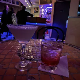 two cocktails on a table