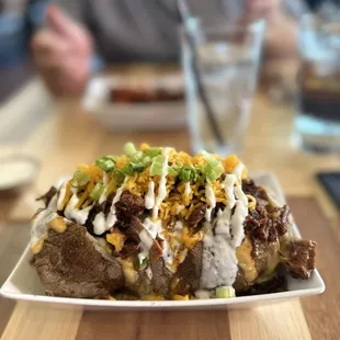 Baked potato stuffed with brisket.