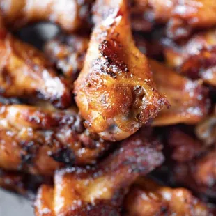 a closeup of a plate of chicken wings