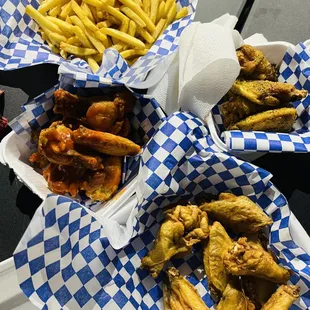 a variety of wings and fries