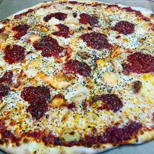 Grandma's Pizza 
Topped with Red Sauce, Roasted Garlic and House Herb Blend. 
Simply Delicious!