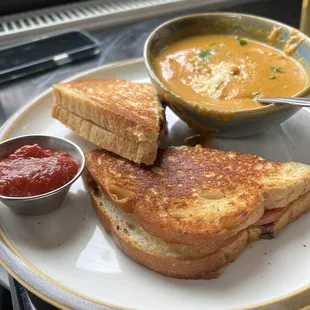 Grilled cheese (comes with tomato) and soup o&apos; the day, carrot bisque