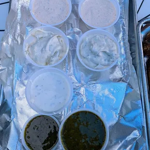 All the sauces. Dirte sauce top, then roasted garlic blue cheese 2nd, ranch 3rd, and merman sauce at the bottom.