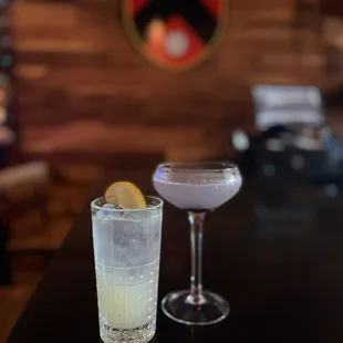 two cocktails on a bar