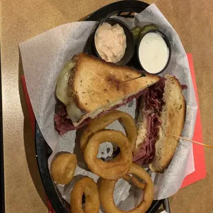 Reuben with onion rings.