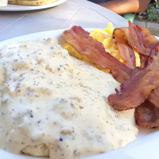 Biscuit and gravy with a side of bacon