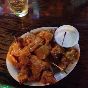 Fried tenders smothered over house fries..