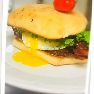 a bacon, egg, lettuce and tomato sandwich