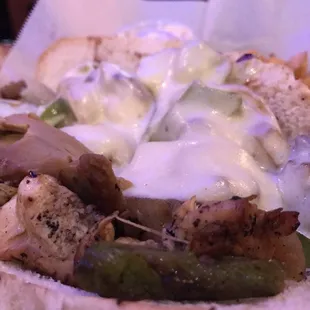 a sandwich with meat and vegetables