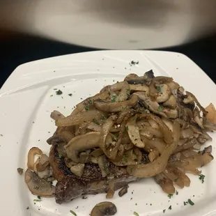 Strip steak with mushrooms and onion