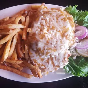 Green Chile Burger Open faced cheese burger smothered in green chile and cheese served with a side of fries