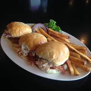 BBQ Sliders Homemade rolls with your choice of in house smoked BBQ pork or brisket topped with our delicious coslaw and served with fries