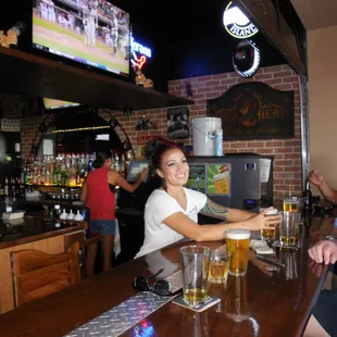 a man and a woman sitting at a bar