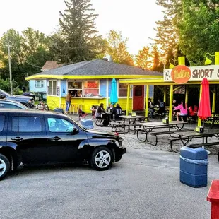 a car parked in front of a restaurant