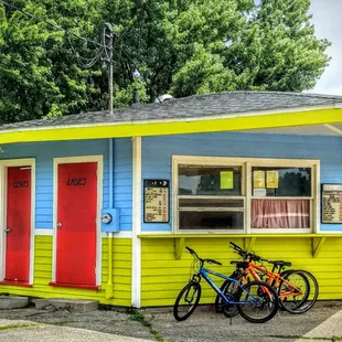 a bicycle parked in front of a brightly colored building