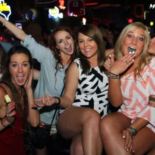 a group of women posing for a picture