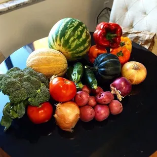 $17 got me a watermelon, cantaloupe, head of broccoli, 4 onions, 2 tomatoes, 3 zucchinis, acorn squash, and a bunch of red potatoes.