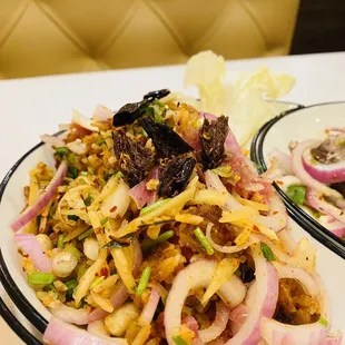 Nam served with red onions and dried hot peppers