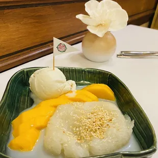Coconut rice served with mango and vanilla ice cream