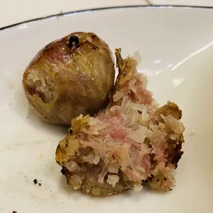 Isaan sausages and inside filled with rice, fermented pork and herbs