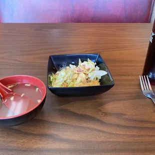 Clear soup with a slight seafood taste. Salad with the salad dressing familiar at many hibachi places. Diet Coke.