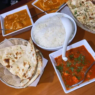 Chicken vindaloo, butter chicken, and butter salmon. For the sides, rice, garlic naan and regular naan.