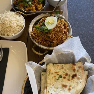 Top aloo gobI, middle chicken biryani, bottom garlic naan