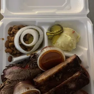 Ribs, brisket, sausage, beans, and potato salad.