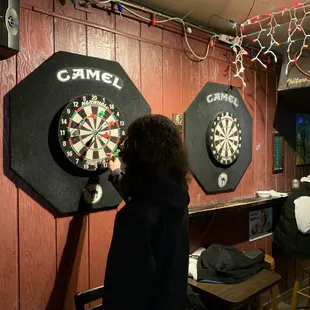 two women playing a game of darts