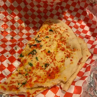 a piece of pizza in a basket