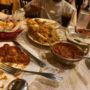 Goat Biryani, Chicken Curry, Fish Vindaloo, Garlic Naan Bread