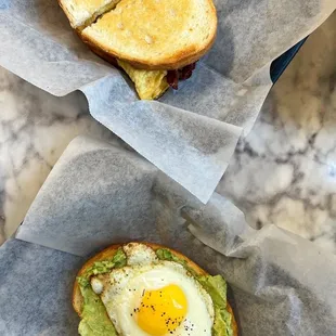 Egg toast and bacon egg and cheese sandwich on sourdough