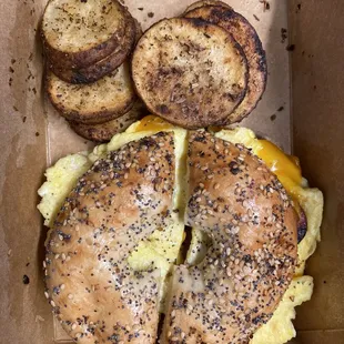 Sausage, egg and cheese on everything bagel with potatoes :)