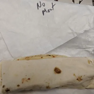 a burrito wrapped in paper