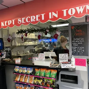 ows a woman behind the counter