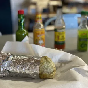 a sandwich wrapped in tin foil